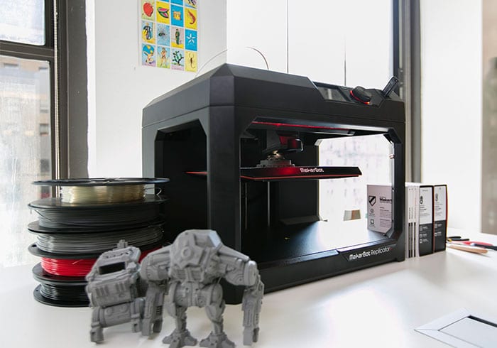 image of MakerBot Replicator + printing a 3d item